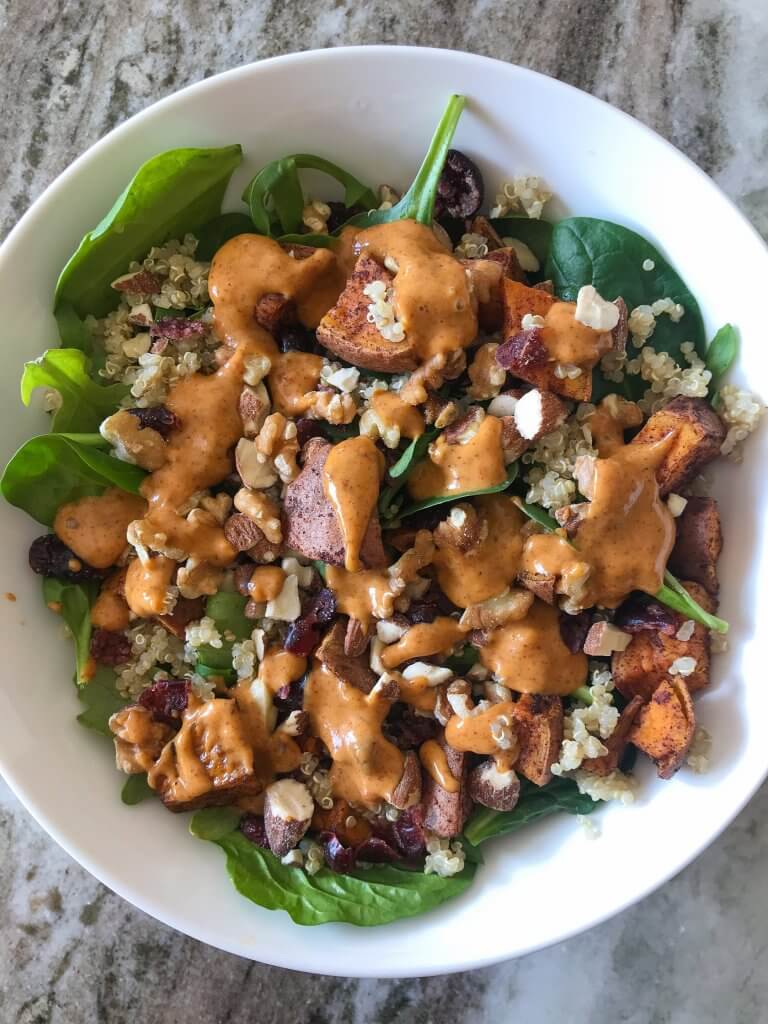 superfood salad with sweet potatoes and ginger almond dressing 
