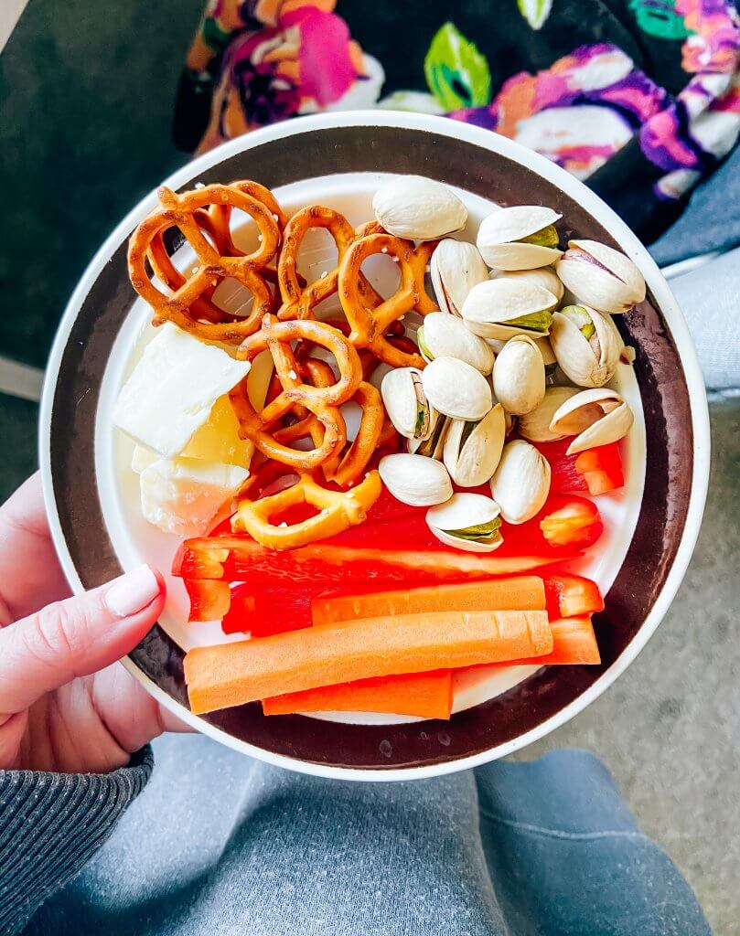 dietitian approved healthy snacks; snack plate with pretzels, cheese, pistachios and carrots