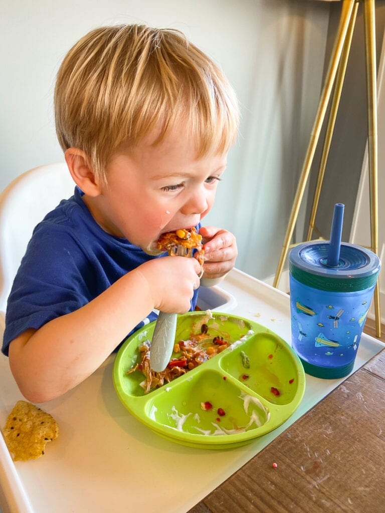 crockpot chicken enchiladas; toddler eating food 