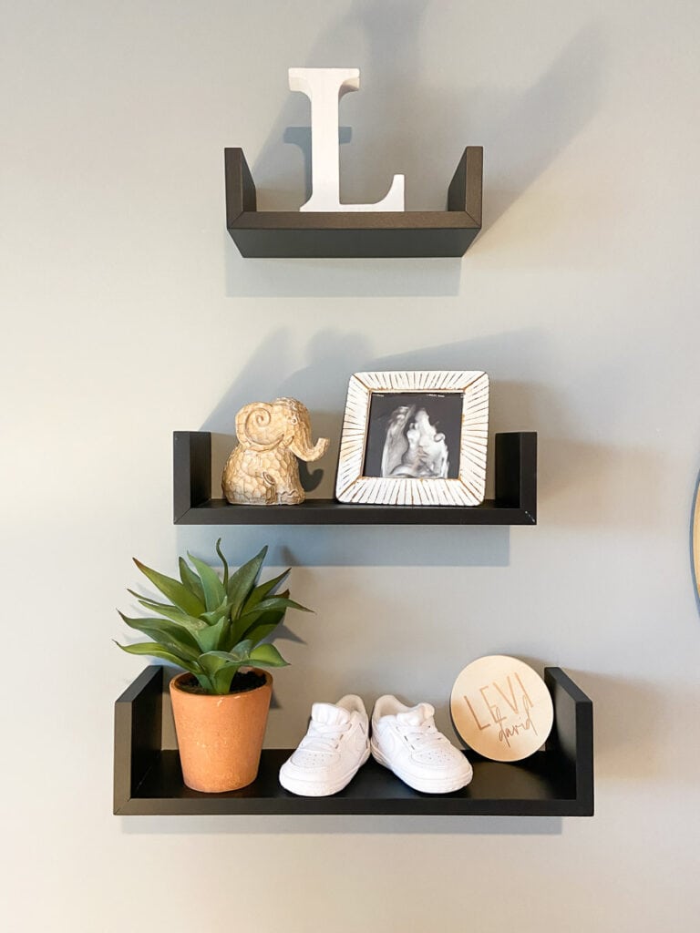 boho baby boy room; floating wall shelves decor 