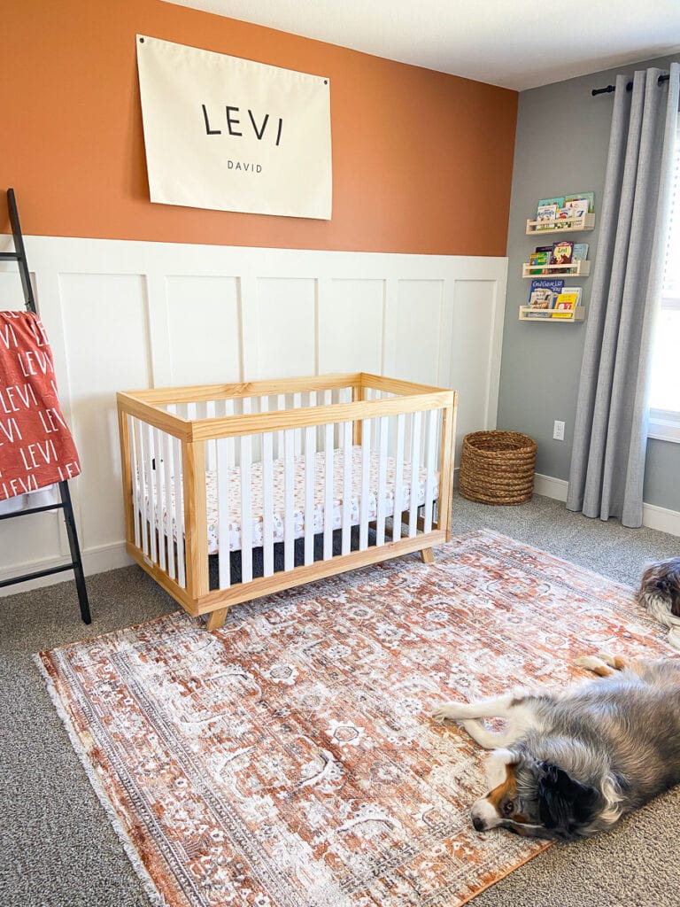 boho baby boy room; crib and accent wall in baby nursery 