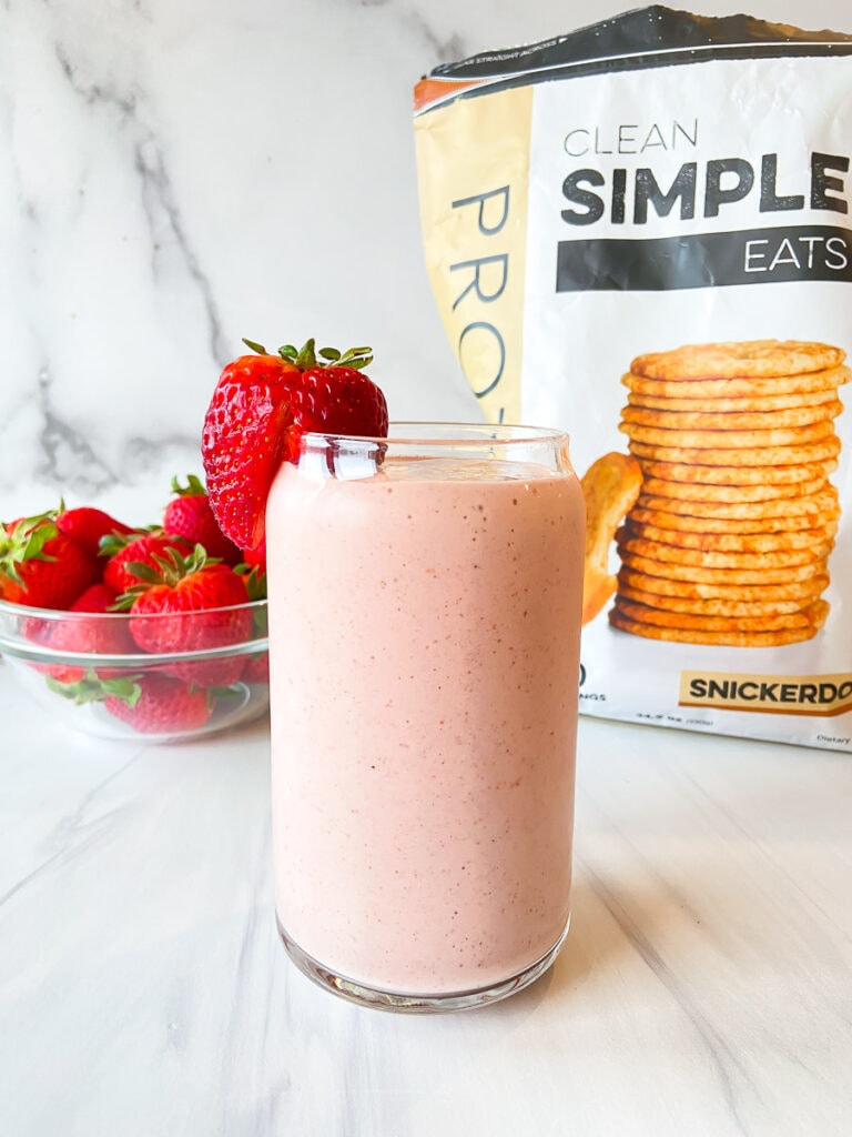 strawberry snickerdoodle smoothie recipe, bowl of strawberries and snickerdoodle Clean Simple Eats protein powder 